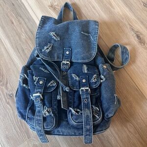 Topshop destroyed denim backpack